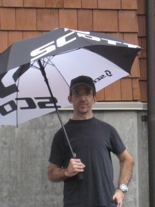 Paul demonstrates how to stand with an umbrella